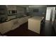 Bright kitchen featuring an island and built-in appliances at 1517 W Sahuaro Dr, Phoenix, AZ 85029