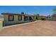 Front view of a light green house with a yard at 1517 W Sahuaro Dr, Phoenix, AZ 85029