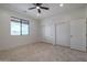 Spacious bedroom with tile floors, ample closet space, and a large window at 40105 N 2Nd Way, Phoenix, AZ 85086