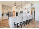 Modern kitchen with white cabinets, stainless steel appliances, and a large island at 40105 N 2Nd Way, Phoenix, AZ 85086