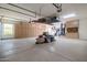 Organized garage with overhead storage, built-in cabinets, and ample floor space at 40105 N 2Nd Way, Phoenix, AZ 85086