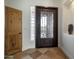Elegant entryway with a custom wood door and a glass block window at 40105 N 2Nd Way, Phoenix, AZ 85086