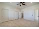 Bright bedroom with tile floors, multiple closets, and en-suite bathroom access at 40105 N 2Nd Way, Phoenix, AZ 85086