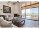 Living room with sliding glass doors that open to a stunning backyard view at 40105 N 2Nd Way, Phoenix, AZ 85086