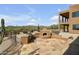 Outdoor kitchen and fireplace with flagstone patio. Scenic mountain views at 40105 N 2Nd Way, Phoenix, AZ 85086