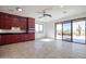 Kitchen with red cabinets, stainless steel appliances and sliding glass doors to a patio at 40105 N 2Nd Way, Phoenix, AZ 85086