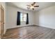 Simple bedroom with dark curtains and ceiling fan at 40105 N 2Nd Way, Phoenix, AZ 85086
