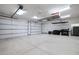 Spacious garage with overhead storage and ample space for vehicles and storage at 40105 N 2Nd Way, Phoenix, AZ 85086