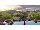 Stunning pool and spa with desert landscape and sunset views at 40105 N 2Nd Way, Phoenix, AZ 85086