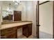 Bathroom with a vanity, walk-in closet, and tile flooring at 40105 N 2Nd Way, Phoenix, AZ 85086