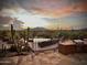 Desert landscape with a pool, patio, and grill at 40105 N 2Nd Way, Phoenix, AZ 85086