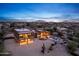 Two-story home with a pool and desert views at dusk at 40105 N 2Nd Way, Phoenix, AZ 85086