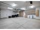 Finished garage with overhead storage, built-in cabinets, and a laundry area at 40105 N 2Nd Way, Phoenix, AZ 85086