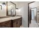 Elegant bathroom with double vanity, tile flooring and a walk-in shower at 40105 N 2Nd Way, Phoenix, AZ 85086