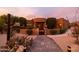 Front view of a beautiful desert home with a gated entrance and landscaped yard at 40105 N 2Nd Way, Phoenix, AZ 85086