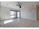 Bright living room with tile floors and sliding glass doors leading to a patio at 40105 N 2Nd Way, Phoenix, AZ 85086