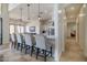 Elegant kitchen boasts white cabinets, a sizable island, and an open layout at 40105 N 2Nd Way, Phoenix, AZ 85086