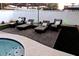 Relaxing backyard with pool, patio furniture, and fire pit at 3487 E Delcoa Dr, Phoenix, AZ 85032