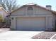 Attached garage with double doors at 1905 E Aire Libre Ave, Phoenix, AZ 85022