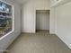 Simple bedroom with large window and closet at 14002 N 49Th Ave # 1074, Glendale, AZ 85306