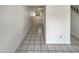 Long hallway with tile flooring leading to the living areas at 14002 N 49Th Ave # 1074, Glendale, AZ 85306