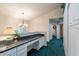 Home office area with granite countertop and built-in cabinets at 7240 N Dreamy Draw Dr # 113, Phoenix, AZ 85020