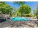 Community pool with lounge chairs and patio furniture at 7240 N Dreamy Draw Dr # 113, Phoenix, AZ 85020