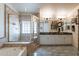 Large bathroom with double vanity, shower, and soaking tub at 7240 N Dreamy Draw Dr # 113, Phoenix, AZ 85020