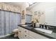 Clean bathroom with double vanity and dark granite countertop at 7240 N Dreamy Draw Dr # 113, Phoenix, AZ 85020