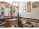Elegant powder room with ornate vanity and decorative mirror at 7240 N Dreamy Draw Dr # 113, Phoenix, AZ 85020