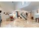 Open living room with high ceilings and staircase to upper level at 7240 N Dreamy Draw Dr # 113, Phoenix, AZ 85020