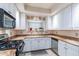 Bright kitchen with granite counters and stainless steel appliances at 7240 N Dreamy Draw Dr # 113, Phoenix, AZ 85020