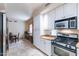 Eat-in kitchen with granite counters and stainless steel appliances at 7240 N Dreamy Draw Dr # 113, Phoenix, AZ 85020