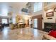 Spacious living room with high ceilings, fireplace, and access to backyard at 7240 N Dreamy Draw Dr # 113, Phoenix, AZ 85020