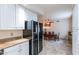 Kitchen with granite countertops, stainless steel appliances, and adjacent dining area at 7240 N Dreamy Draw Dr # 113, Phoenix, AZ 85020