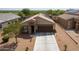 House with solar panels, driveway and landscaping at 2040 N Ensenada Ln, Casa Grande, AZ 85122