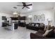 Open floor plan with kitchen island, living room, and plenty of natural light at 2040 N Ensenada Ln, Casa Grande, AZ 85122