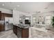 Open concept kitchen with an island, stainless steel appliances, and views to the living room at 3407 E Glacier Pl, Chandler, AZ 85249