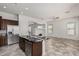 Open concept kitchen with an island, stainless steel appliances, and views to the living room at 3407 E Glacier Pl, Chandler, AZ 85249