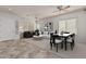 Bright living room with neutral walls, tile flooring, and a dining area at 3407 E Glacier Pl, Chandler, AZ 85249