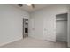Small bedroom with neutral walls, carpet and sliding door closet at 3407 E Glacier Pl, Chandler, AZ 85249