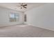 Bright bedroom featuring neutral walls and carpet, ceiling fan at 3407 E Glacier Pl, Chandler, AZ 85249