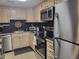 Kitchen boasts stainless steel appliances and light wood cabinets at 815 N Hayden Rd # B2, Scottsdale, AZ 85257