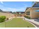 Putting green and outdoor kitchen with pergola at 3058 E Spring Wheat Ln, Gilbert, AZ 85296