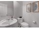 Clean and modern bathroom with a pedestal sink and updated fixtures at 22706 N 17Th St, Phoenix, AZ 85024