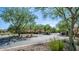 Gated entrance to a community with lush landscaping at 7351 W Palo Brea Ln, Peoria, AZ 85383