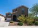 Two-story house with a gray facade and arched entryway at 7351 W Palo Brea Ln, Peoria, AZ 85383