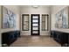 Elegant entryway featuring a modern chandelier and stylish consoles at 16004 E Bobwhite Way, Scottsdale, AZ 85262