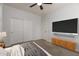 Serene bedroom featuring a large TV and ample closet space at 2848 E Presidio St, Mesa, AZ 85213