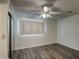 Bedroom with wood-look flooring and mirrored closet doors at 15444 N 23Rd St, Phoenix, AZ 85022